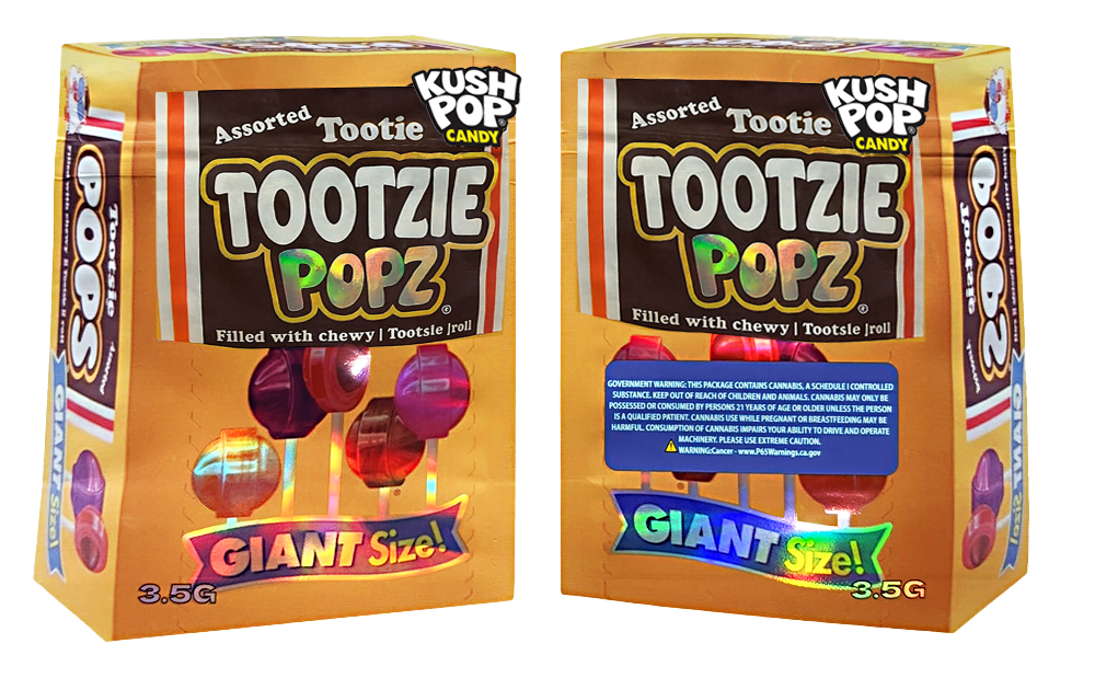 Two Mylar Bag boxes of Tootzie Popz candy, one with a blue label and the other with a red label, on a white background.