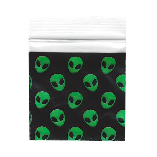 Mylar Bags, Cannabis Mylar Bags, , Where to buy mylar bags, Custom mylar bags near me, Mylar Bags Wholesale. Clear plastic bag with green alien pattern on a black background